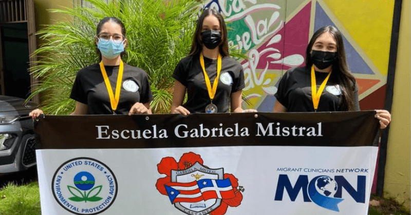 Participants at the school holding a sign for the EPA project